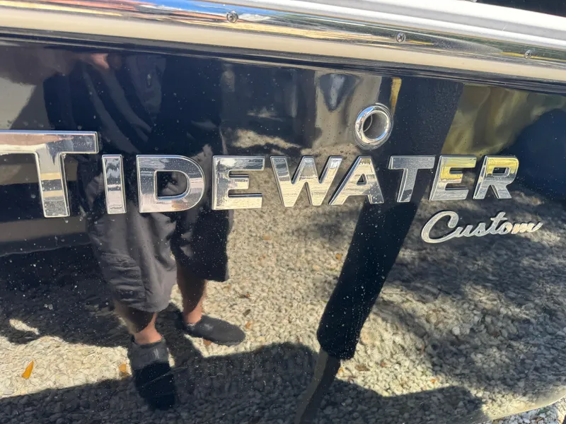 Slide: The Image of Tidewater 2500 Carolina Bay 2020 boat logo on reflective surface. - 3