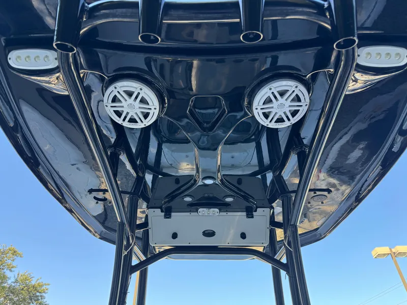 Slide: The Image of 2020 Tidewater 2500 Carolina Bay boat with speakers and lights on the T-top. - 37