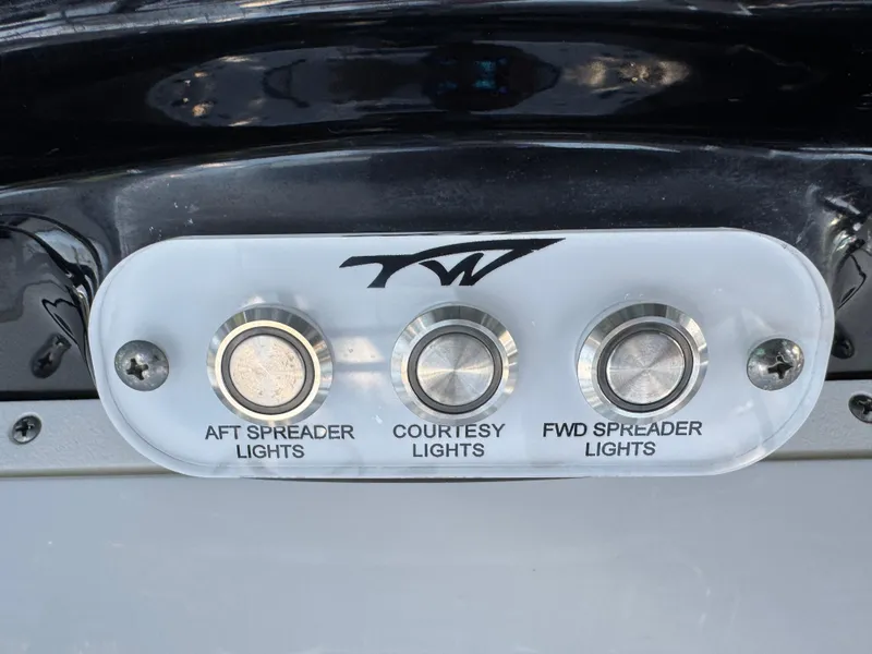 Slide: The Image of Control panel for lights on 2020 Tidewater 2500 Carolina Bay boat. - 38