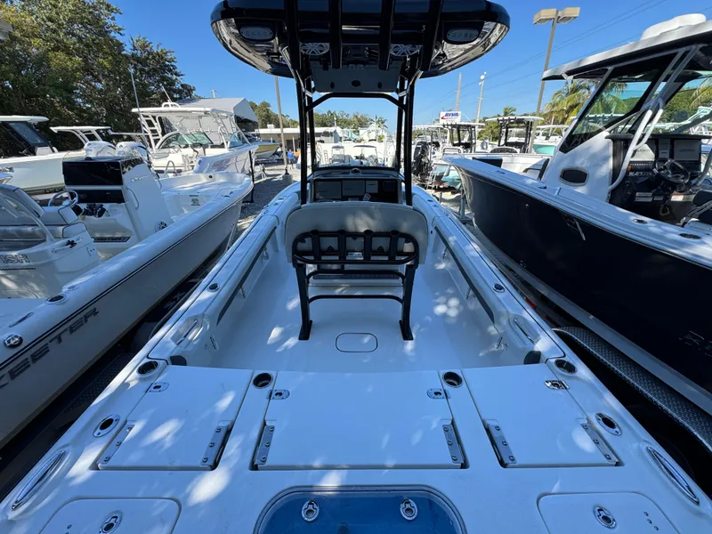 Slide: The Image of 2020 Tidewater 2500 Carolina Bay boat, spacious deck, sleek design, marina setting. - 5