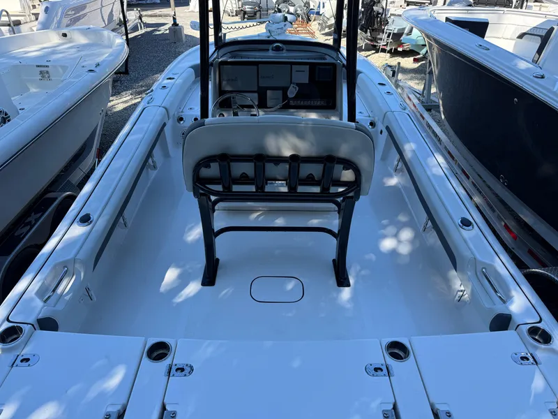 Slide: The Image of 2020 Tidewater 2500 Carolina Bay boat interior, featuring spacious deck and seating. - 6