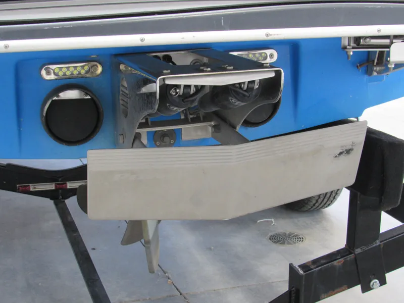 Slide: The Image of 2012 Malibu Wakesetter 22 MXZ boat rear view with wakeboard features. - 12