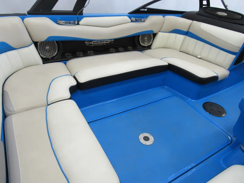 Slide: The Image of 2012 Malibu Wakesetter 22 MXZ interior with blue and cream seating. - 5