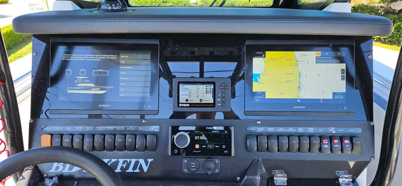 Slide: The Image of Control panel of a 2020 Blackfin 272 CC boat with navigation screens and controls. - 13