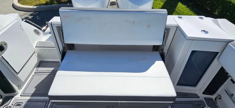 Slide: The Image of 2020 Blackfin 272 CC boat seating area with storage compartments. - 16