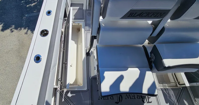 Slide: The Image of 2020 Blackfin 272 CC boat interior with seating and storage compartments. - 24