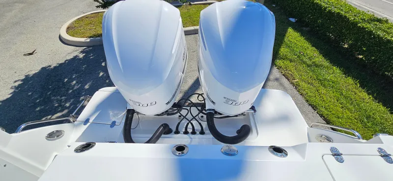 Slide: The Image of 2020 Blackfin 272 CC boat with twin outboard engines, viewed from above. - 25