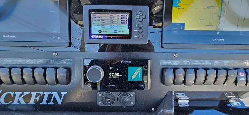 Slide: The Image of Control panel of a 2020 Blackfin 272 CC boat with Garmin and Yamaha displays. - 27