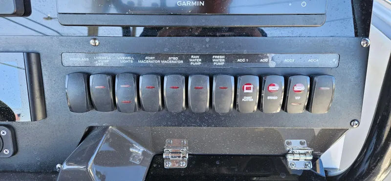 Slide: The Image of Control panel of a 2020 Blackfin 272 CC boat with labeled switches. - 36