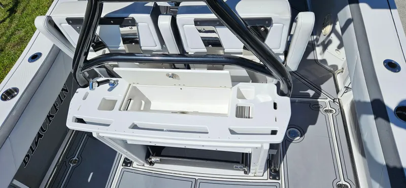 Slide: The Image of 2020 Blackfin 272 CC boat interior with seating and storage compartments. - 37