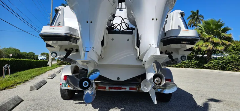 Slide: The Image of 2020 Blackfin 272 CC boat with dual outboard engines on a trailer. - 5