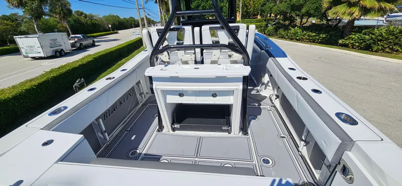 Slide: The Image of 2020 Blackfin 272 CC boat interior with seating and storage compartments. - 6
