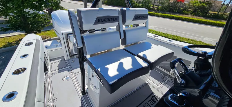 Slide: The Image of 2020 Blackfin 272 CC boat interior with dual seating and modern design. - 7