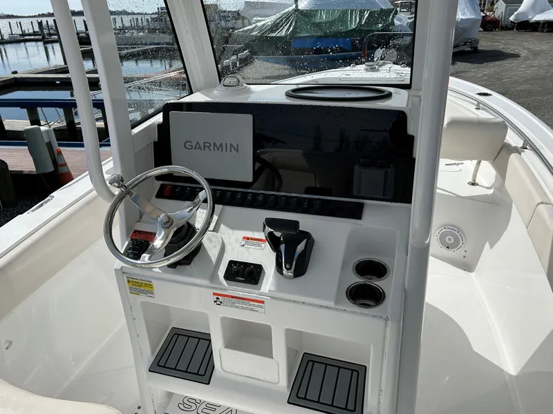 Slide: The Image of 2022 Sea Hunt Ultra 239 SE boat console with Garmin navigation system. - 9