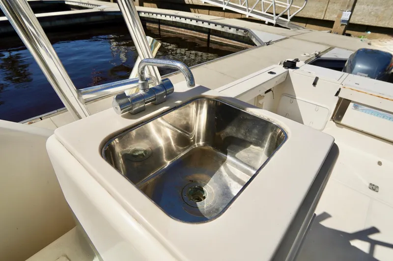 Slide: The Image of Stainless steel sink on 2003 Pursuit 3070 Express boat deck. - 33