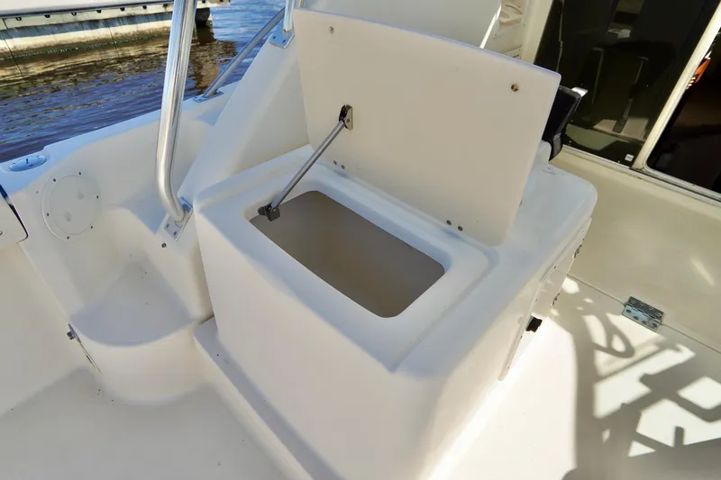 Slide: The Image of Open storage compartment on 2003 Pursuit 3070 Express boat deck. - 35
