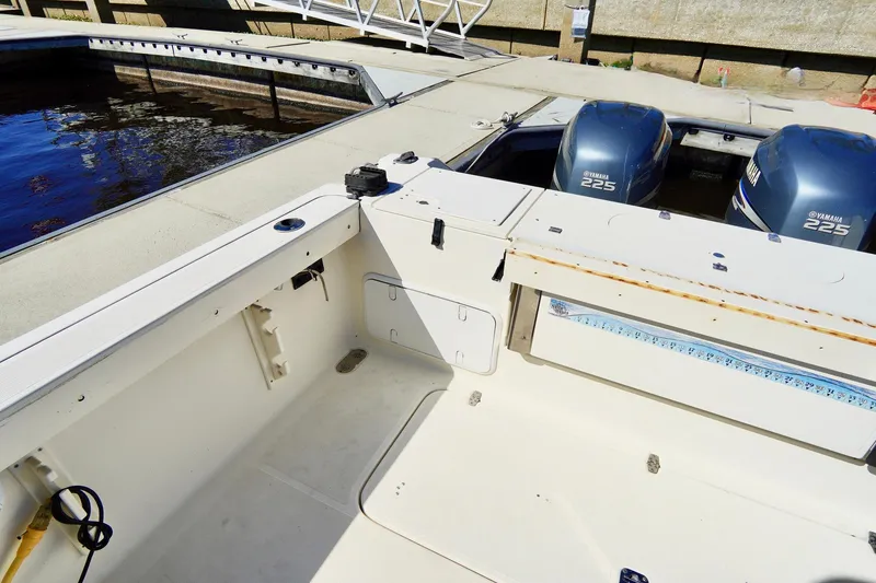 Slide: The Image of 2003 Pursuit 3070 Express boat with twin Yamaha 225 engines at dock. - 36