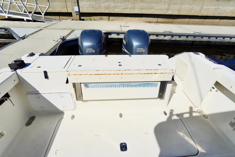 Slide: The Image of 2003 Pursuit 3070 Express boat with twin engines at dock. - 37