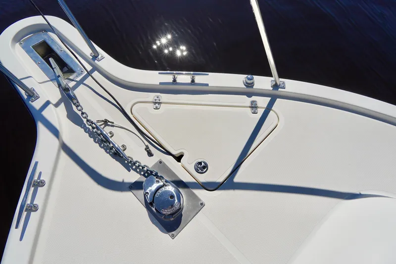 Slide: The Image of Bow of a 2003 Pursuit 3070 Express boat with anchor chain and winch. - 4