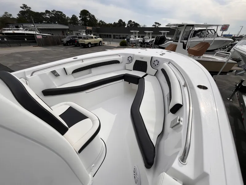 Slide: The Image of 2025 Tidewater 232 LXF boat with sleek seating and modern design. - 13
