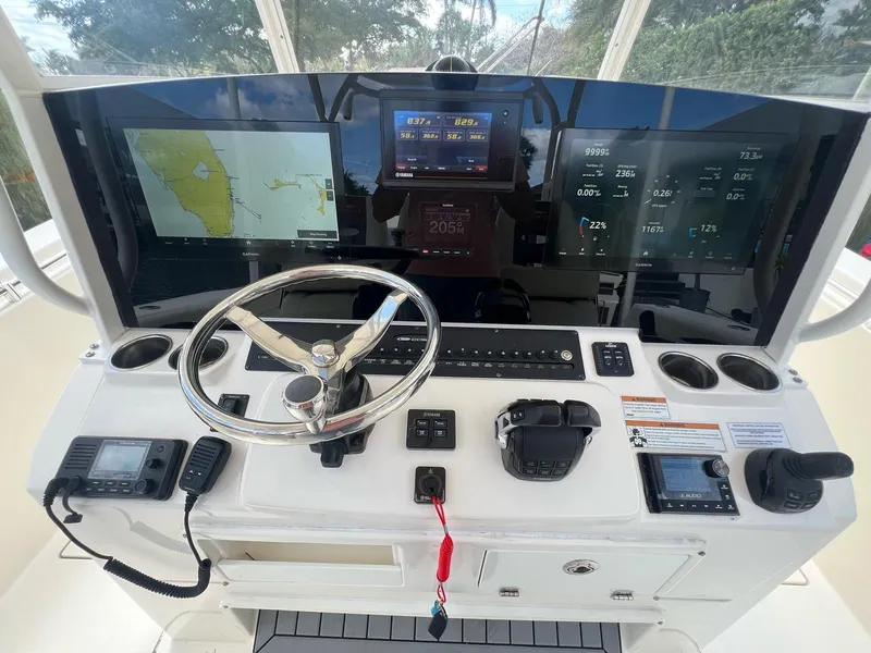 Slide: The Image of Helm of 2020 Cobia 350 boat with advanced navigation and control systems. - 4