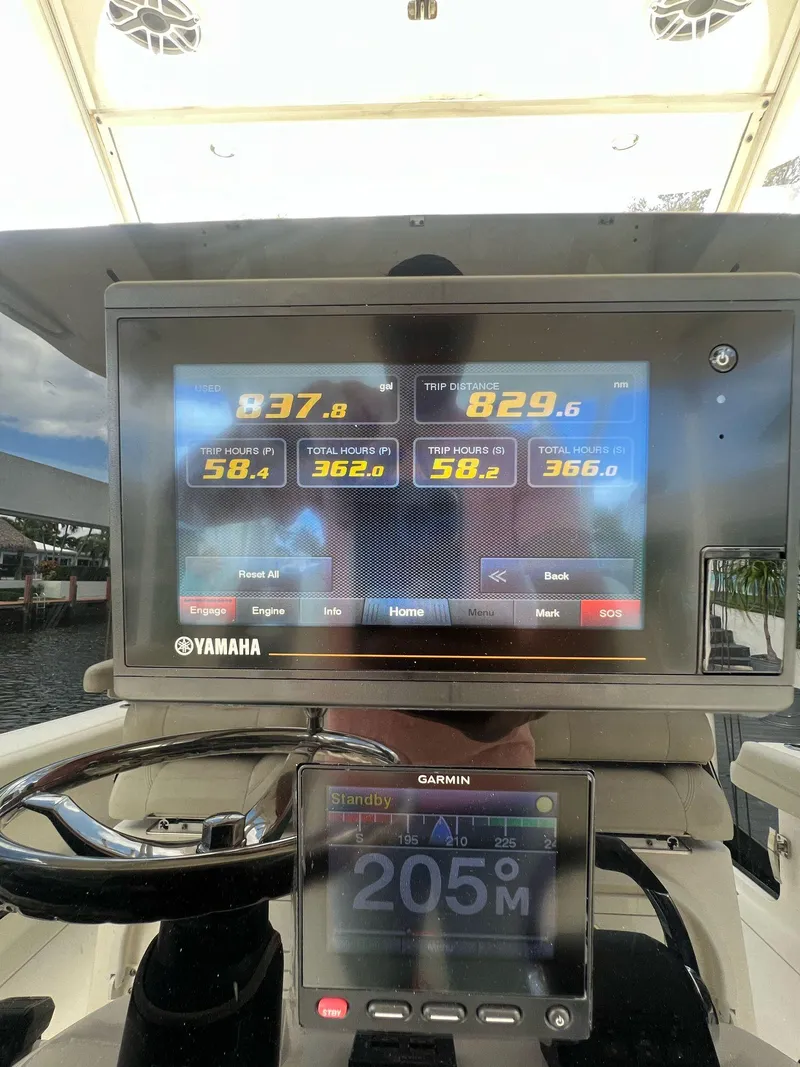 Slide: The Image of Cobia 350 boat dashboard with Yamaha and Garmin displays, 2020 model. - 7