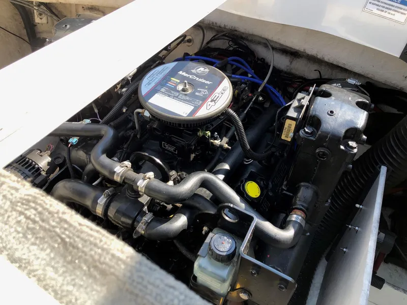 Slide: The Image of 2011 Sea Ray 195 Sport engine compartment, showcasing detailed mechanical components. - 10