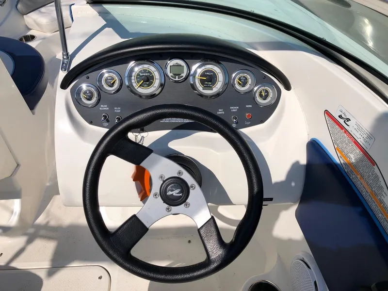 Slide: The Image of Steering wheel and dashboard of 2011 Sea Ray 195 Sport boat. - 6