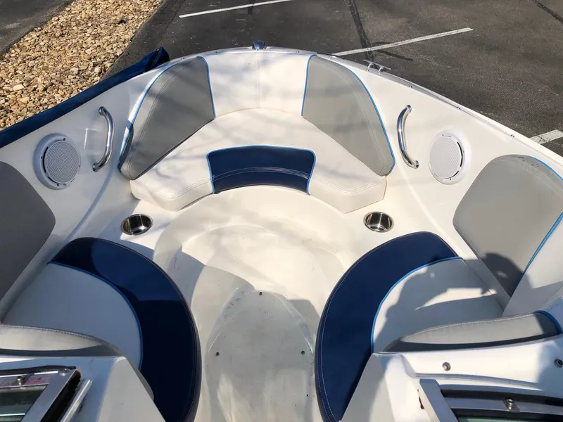 Slide: The Image of 2011 Sea Ray 195 Sport boat interior with blue and gray seating. - 7