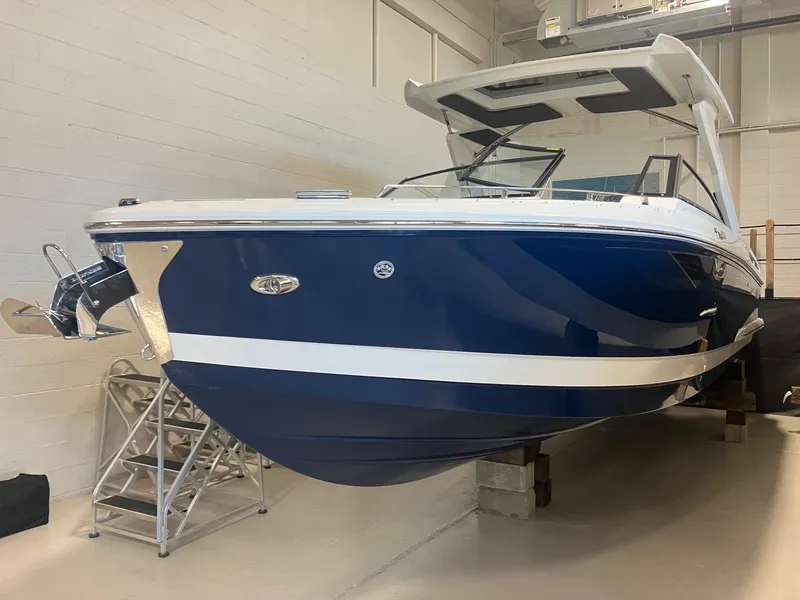The Image of 2025 Cobalt A29 boat in showroom, blue and white design, sleek and modern appearance. - 0