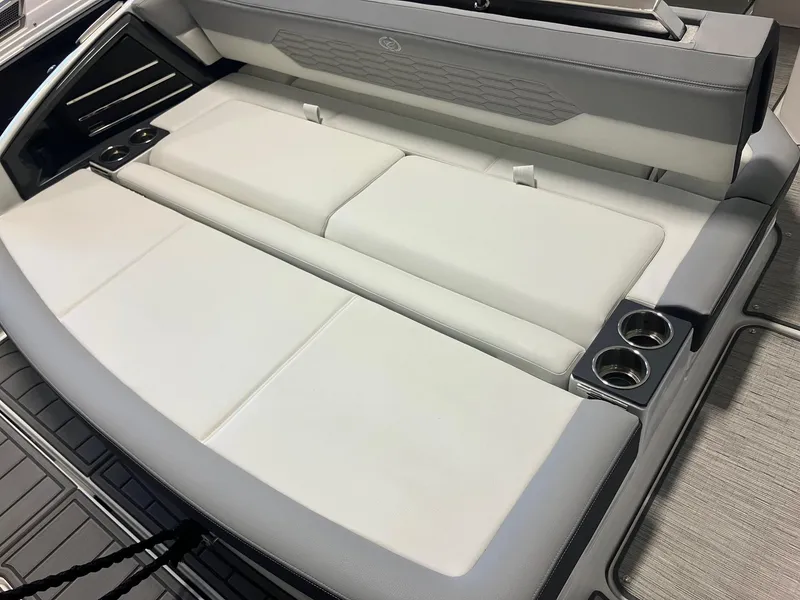 Slide: The Image of 2025 Cobalt A29 boat interior with sleek white seating and integrated cup holders. - 2