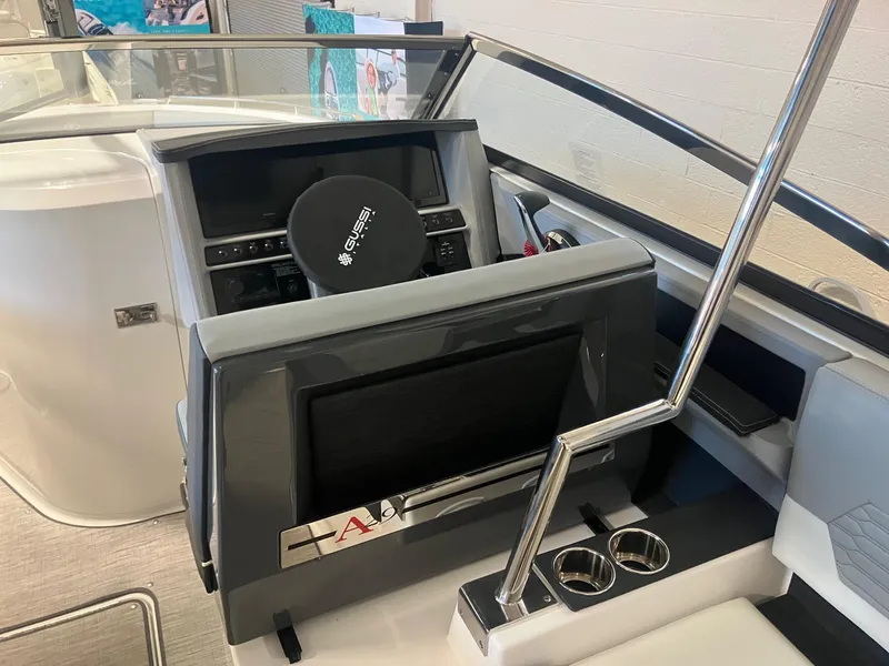 Slide: The Image of 2025 Cobalt A29 boat helm with modern controls and sleek design. - 8