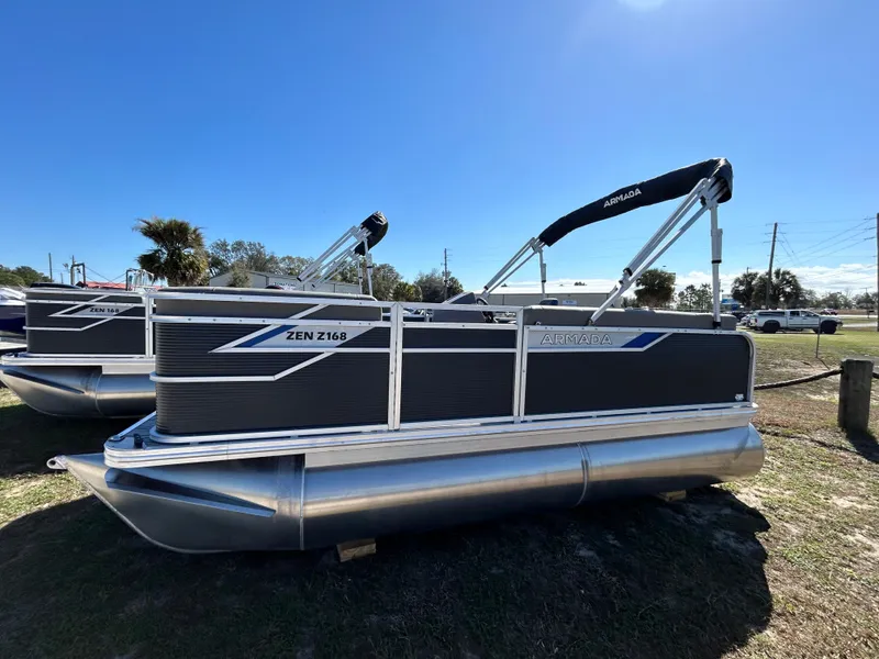The Image of 2025 Armada Zen Z 168 pontoon boat displayed outdoors under clear blue sky. - 1