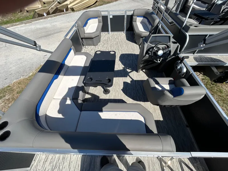 Slide: The Image of Interior of 2025 Armada Zen Z 168 pontoon boat with seating and steering console. - 11