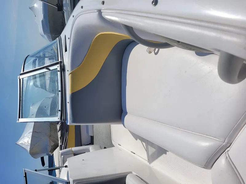 Slide: The Image of 2002 Moomba Outback LSV boat interior with gray and yellow seating. - 12