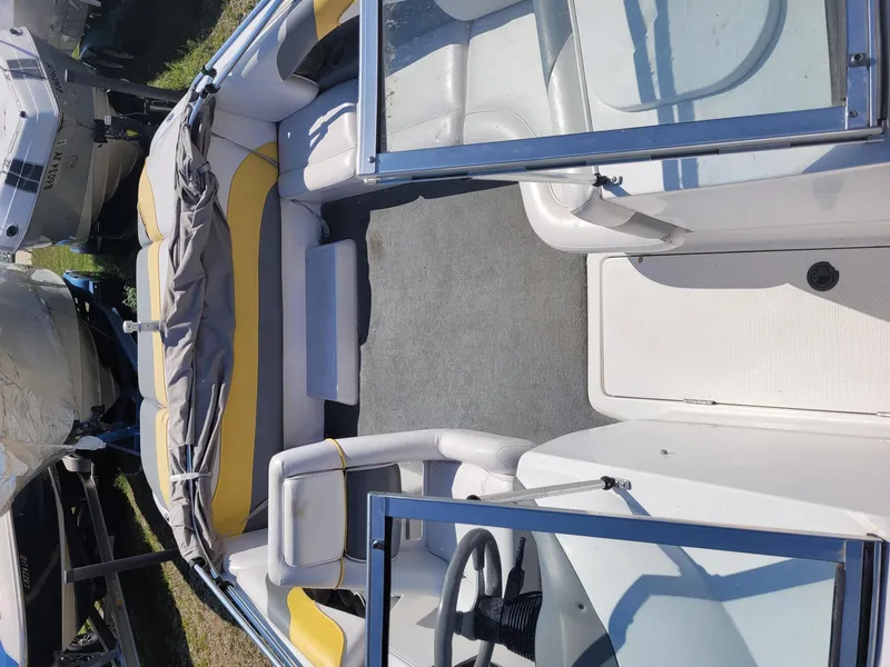 Slide: The Image of 2002 Moomba Outback LSV boat interior with yellow and gray seating. - 13