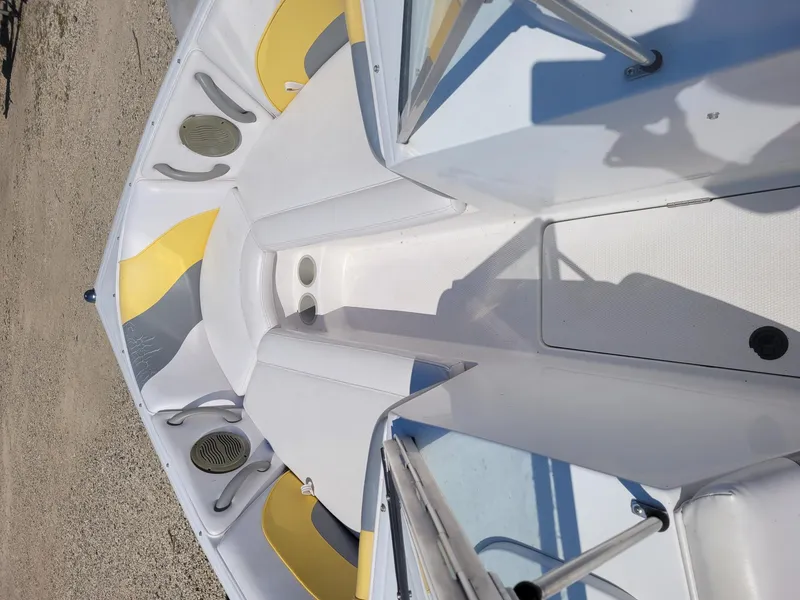 Slide: The Image of 2002 Moomba Outback LSV boat interior with yellow and gray accents. - 8