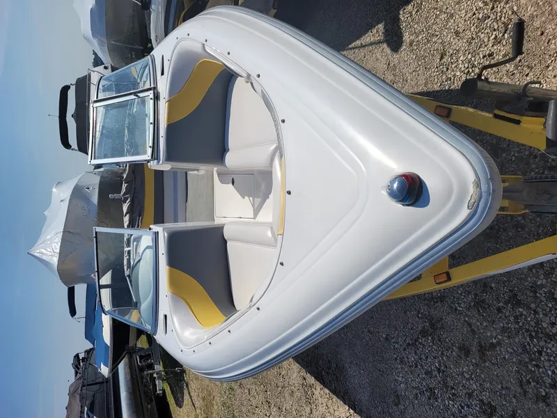 Slide: The Image of 2002 Moomba Outback LSV boat with open bow seating on a trailer. - 9