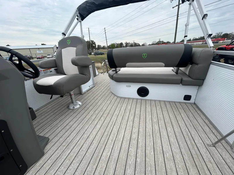 Slide: The Image of 2025 Armada Saphir 19SB boat interior with gray seating and wood-textured flooring. - 10