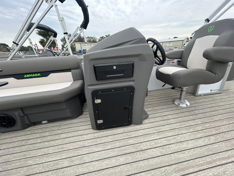 Slide: The Image of Armada Saphir 19SB 2025 boat interior with seating and control panel. - 11