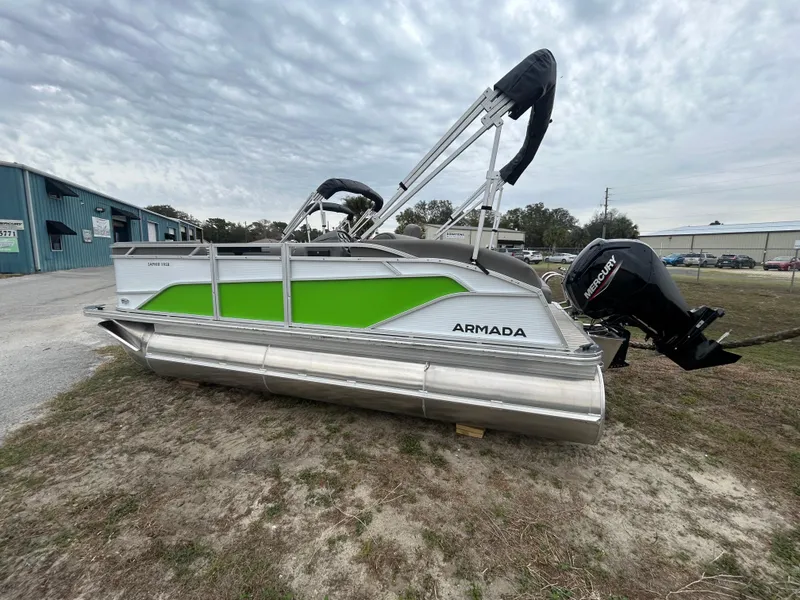 Slide: The Image of 2025 Armada Saphir 19SB pontoon boat with green accents and outboard motor. - 3