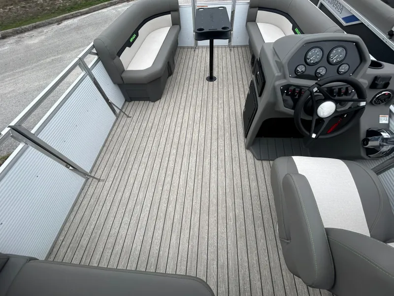 Slide: The Image of 2025 Armada Saphir 19SB boat interior with modern seating and steering console. - 7