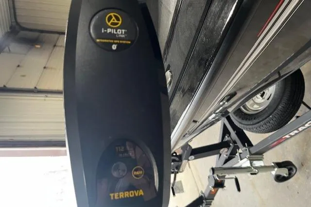 Slide: The Image of 2022 Tracker Targa 18 WT with Terrova i-Pilot trolling motor in garage. - 6