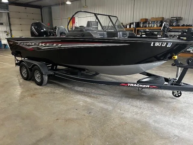 Slide: The Image of 2022 Tracker Targa 18 WT boat on trailer in indoor storage facility. - 8