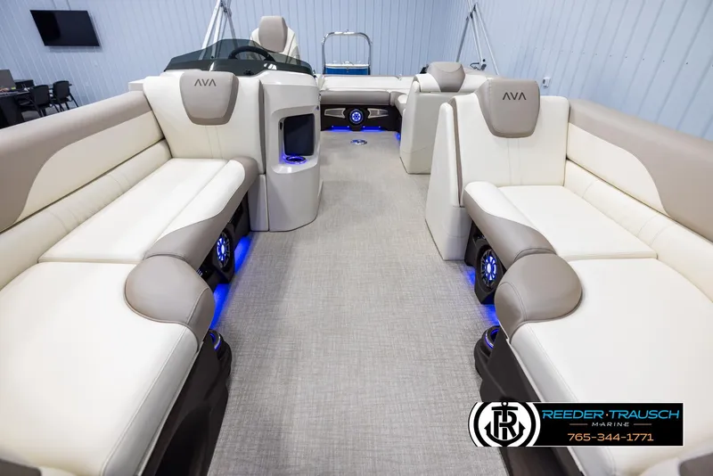 Slide: The Image of 2025 Avalon LSZ VRB boat interior with beige seating and blue LED lighting. - 13
