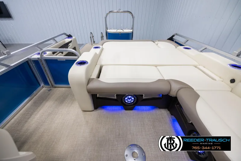 Slide: The Image of 2025 Avalon LSZ VRB boat interior with plush seating and blue LED lighting. - 15