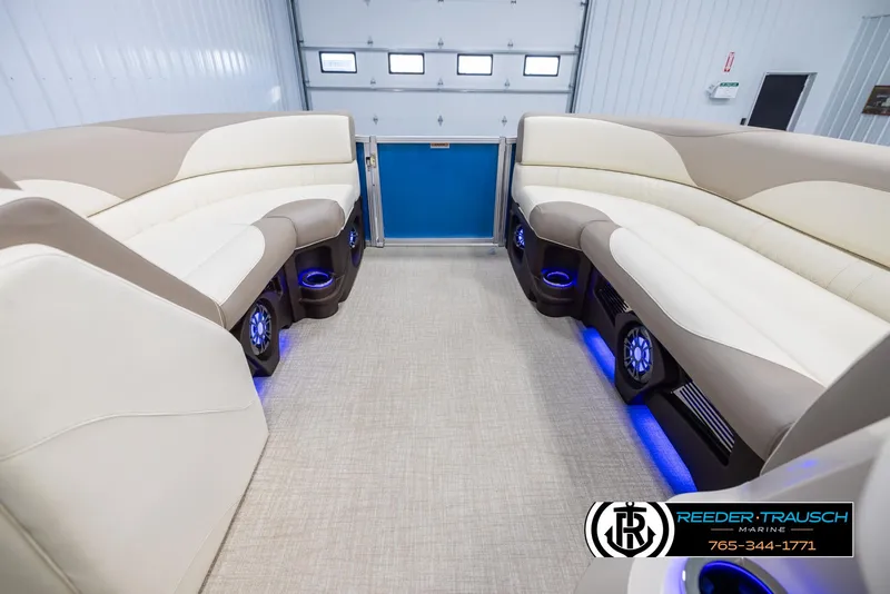 Slide: The Image of 2025 Avalon LSZ VRB interior with beige seating and blue LED lighting. - 18