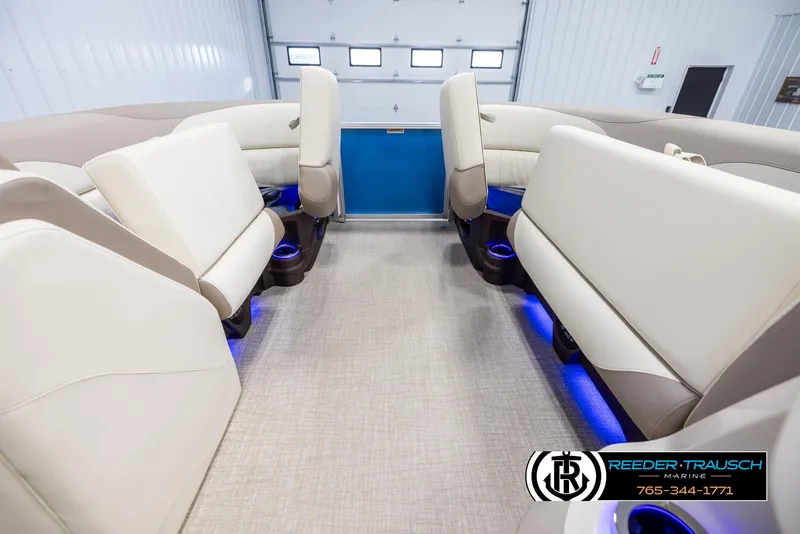 Slide: The Image of 2025 Avalon LSZ VRB interior with beige seating and blue LED lighting. - 19