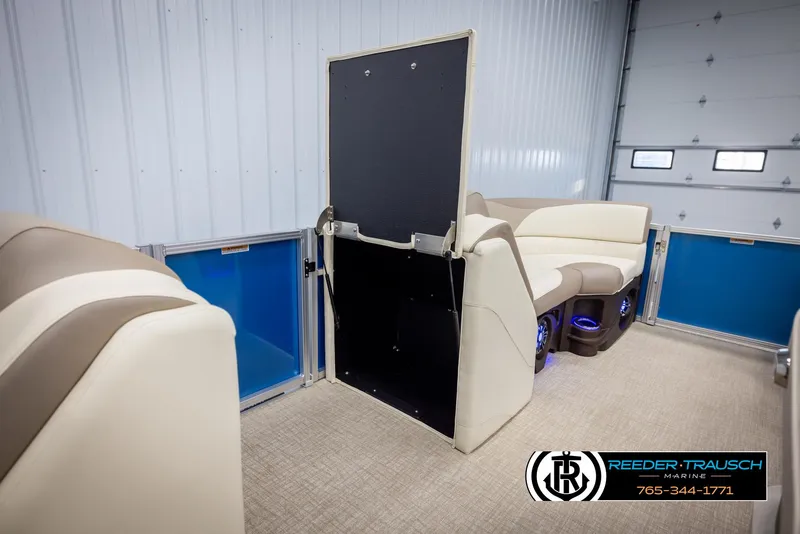 Slide: The Image of 2025 Avalon LSZ VRB interior with beige seating and blue storage compartments. - 21