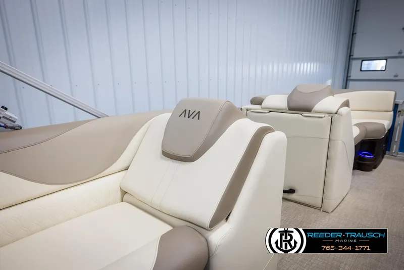 Slide: The Image of 2025 Avalon LSZ VRB boat interior with beige and white seating, Reeder-Trausch Marine logo. - 22